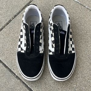 Women’s black/white checkered Vans.